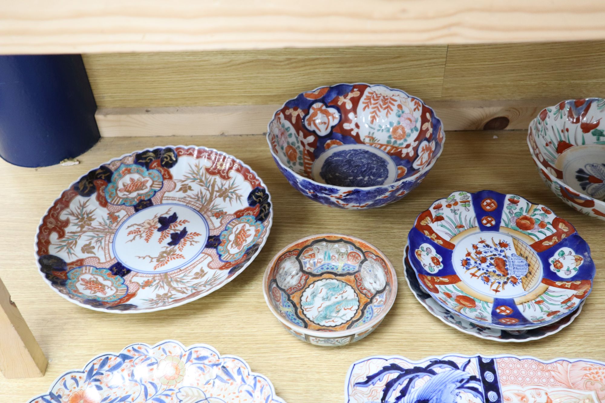 A collection of Japanese Imari dishes, bowls and a large square dish